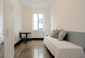 A bed or beds in a room at La Casa della Fiore