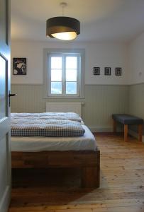 מיטה או מיטות בחדר ב-Huber Xaveri - Hof