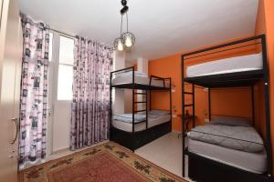 Postel nebo postele na pokoji v ubytování Kultura Hostel