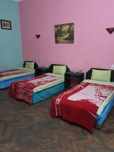 Postel nebo postele na pokoji v ubytování African House Hostel