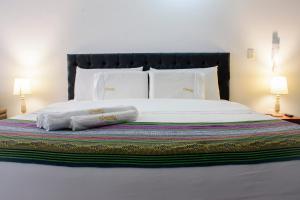 Postel nebo postele na pokoji v ubytování Samalá Casa Hotel