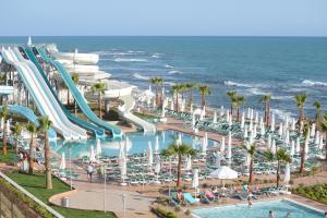 a water slide at a resort next to the ocean at Vikingen Infinity Resort & Spa in Avsallar