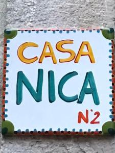 a sign on a wall that reads casa natal at Casanica-Taormina in Taormina