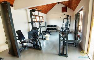 a gym with several tread machines in a room at Pousada Algodão da Praia in Araruama