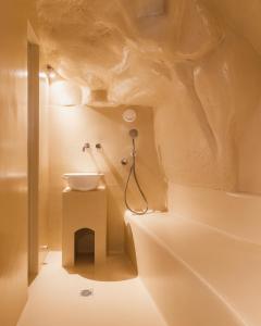 a bathroom with a sink and a shower at La Corte Dei Pastori Luxury in Matera