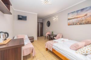 Łóżko lub łóżka w pokoju w obiekcie Villa Rafałko