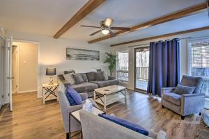 a living room with a couch and chairs at Mount Ida Condo - Walk to Lake Ouachita! in Mount Ida