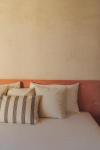 Postel nebo postele na pokoji v ubytování Casa Peregrino Holbox