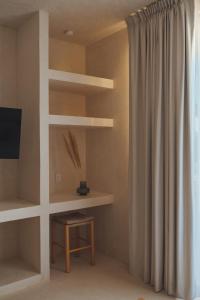 TV a/nebo společenská místnost v ubytování Casa Peregrino Holbox