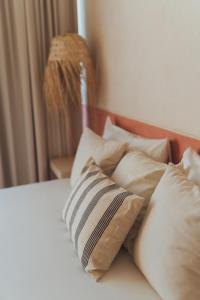 Postel nebo postele na pokoji v ubytování Casa Peregrino Holbox
