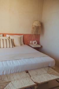 Postel nebo postele na pokoji v ubytování Casa Peregrino Holbox