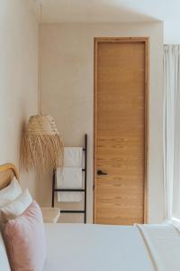 Postel nebo postele na pokoji v ubytování Casa Peregrino Holbox