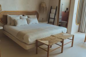 Postel nebo postele na pokoji v ubytování Casa Peregrino Holbox