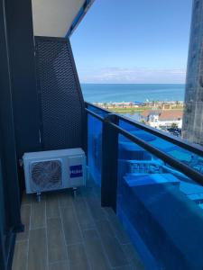 a balcony with a view of the ocean at ORBI City studio 536 in Batumi