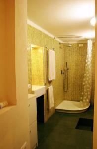 a bathroom with a shower and a sink at Residenze Palazzo Pes in Cagliari