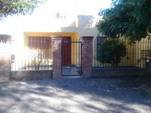 a gate in front of a house at Casa Quinta en Luján - Olivera in Olivera