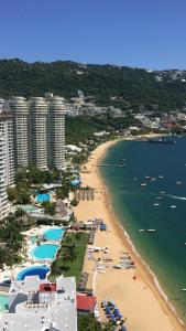 an aerial view of a beach with buildings and the ocean at Acapulco Cuerdas de mi Guitarra alberca abierta in Acapulco +96 photos