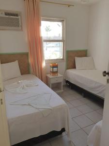 Postel nebo postele na pokoji v ubytování Apartamento 2 quartos