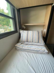 Voodi või voodid majutusasutuse Little Garden Dream Life Home toas