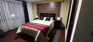 Postel nebo postele na pokoji v ubytování Hostal Jerian