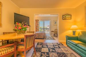 a living room with a couch and a table at Boardwalk Terrace Apartments in Ocean City