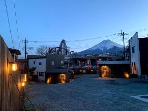 a view of a city with a mountain in the background at MIYABI Highland Terrace Villa A in Fujiyoshida