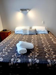 Postel nebo postele na pokoji v ubytování Academy Lodge Motel