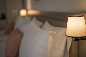 A bed or beds in a room at Dovv Hotel Busıness
