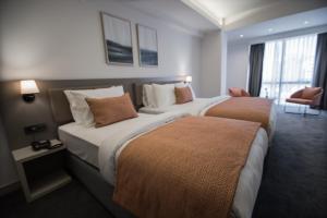 A bed or beds in a room at Dovv Hotel Busıness