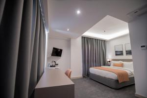 A bed or beds in a room at Dovv Hotel Busıness