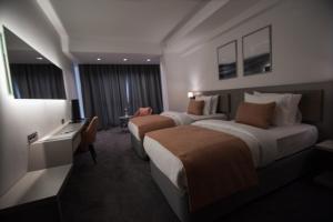 A bed or beds in a room at Dovv Hotel Busıness