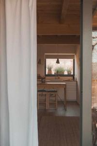 a dining room with a table and a window at Casa Diana C in Girona