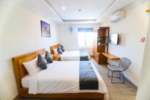 Giường trong phòng chung tại Sea Star Hotel Quy Nhon