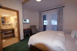 Voodi või voodid majutusasutuse Alpenhotel Ensmann toas