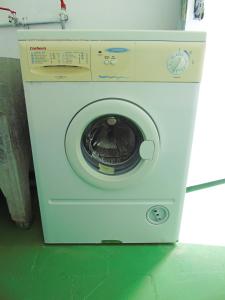 a washing machine with its door open in a room at Fleitas Penthouse with terrace in San Andrés