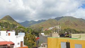 a view of a city with mountains in the background at Fleitas Penthouse with terrace in San Andrés