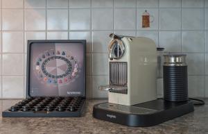 a kitchen counter with an old typewriter and a blender at LUXURY PENTHOUSE APARTMENT WITH 3 Balconies -2 BEDROOMS -PETRUS VIEW & PARKING in Luxembourg