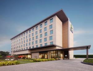 a rendering of the front of a hotel at Holiday Inn Express Kolkata Airport, an IHG Hotel in Kolkata