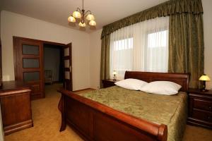 Łóżko lub łóżka w pokoju w obiekcie Hotel Salamandra
