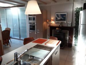 a kitchen with a sink and a stove at Villa commune PoldersView in Sluis