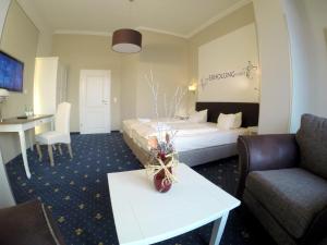 Postel nebo postele na pokoji v ubytování Hotel Villa Schwanebeck