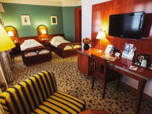Postel nebo postele na pokoji v ubytování Mercure Grand Hotel Biedermeier Wien