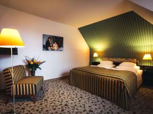 Postel nebo postele na pokoji v ubytování Mercure Grand Hotel Biedermeier Wien
