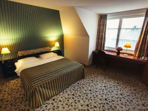 Postel nebo postele na pokoji v ubytování Mercure Grand Hotel Biedermeier Wien