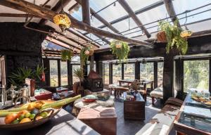 a living room with a bunch of fruits on a table at Wolf Totem Lux Backpacker Industrial Studio in Pisac