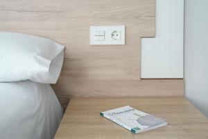 Posteľ alebo postele v izbe v ubytovaní Hotel VIDA Finisterre Centro