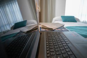 Posteľ alebo postele v izbe v ubytovaní Hotel VIDA Finisterre Centro