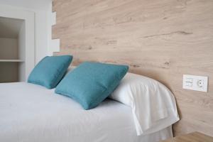 Posteľ alebo postele v izbe v ubytovaní Hotel VIDA Finisterre Centro