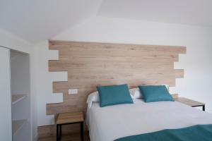 Posteľ alebo postele v izbe v ubytovaní Hotel VIDA Finisterre Centro