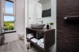 a bathroom with a sink and a toilet at Villa Venka in Rab